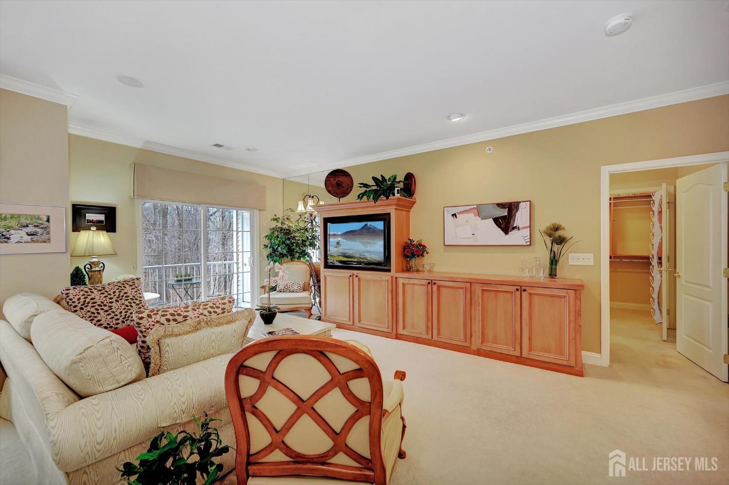 1322 Falston Circle Old Bridge, NJ 08857 - Photo 9 of 38 a living room with furniture a flat screen tv and a dresser
