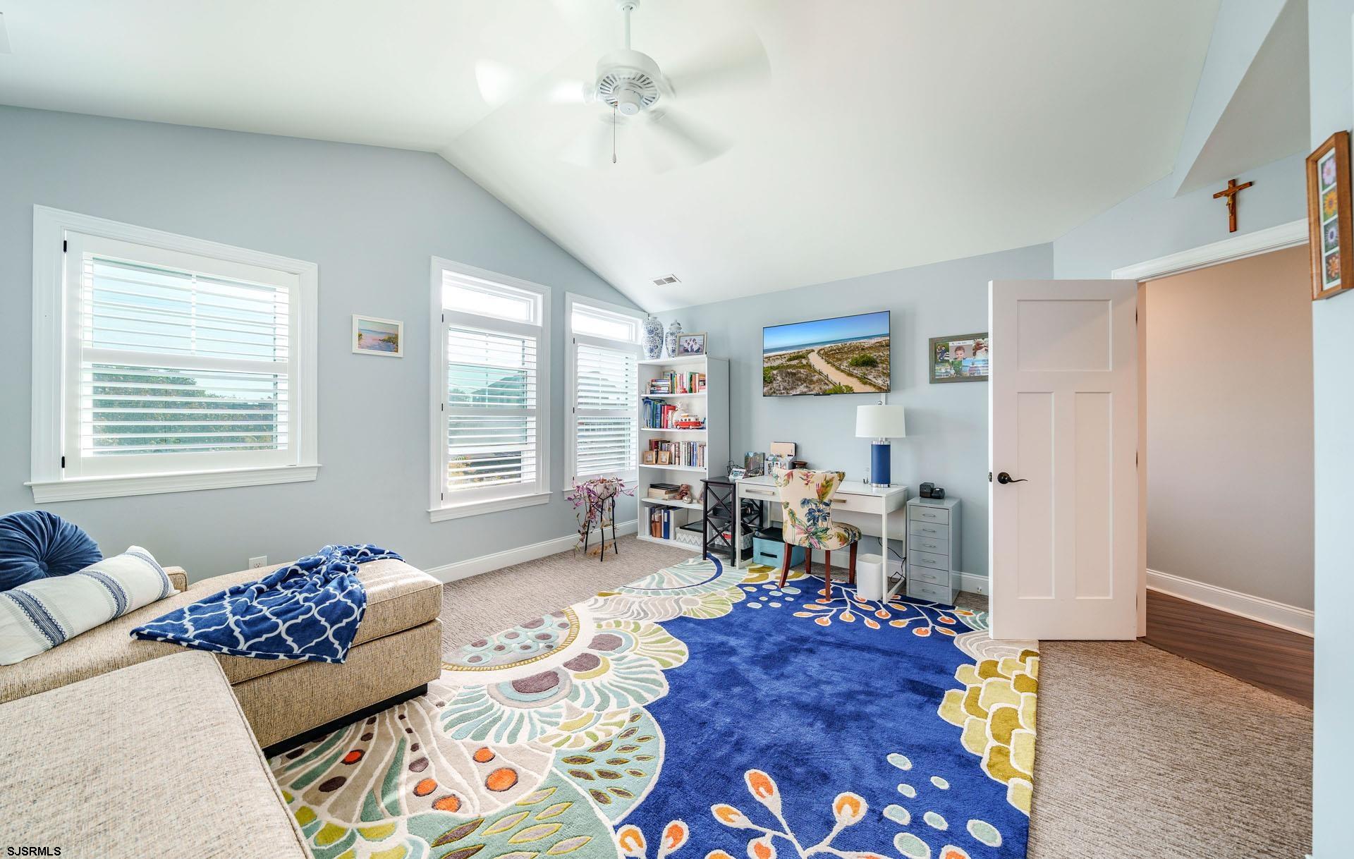 230 West Seaspray Road Ocean City, NJ 08226 - Photo 23 of 45 a living room with furniture and a window