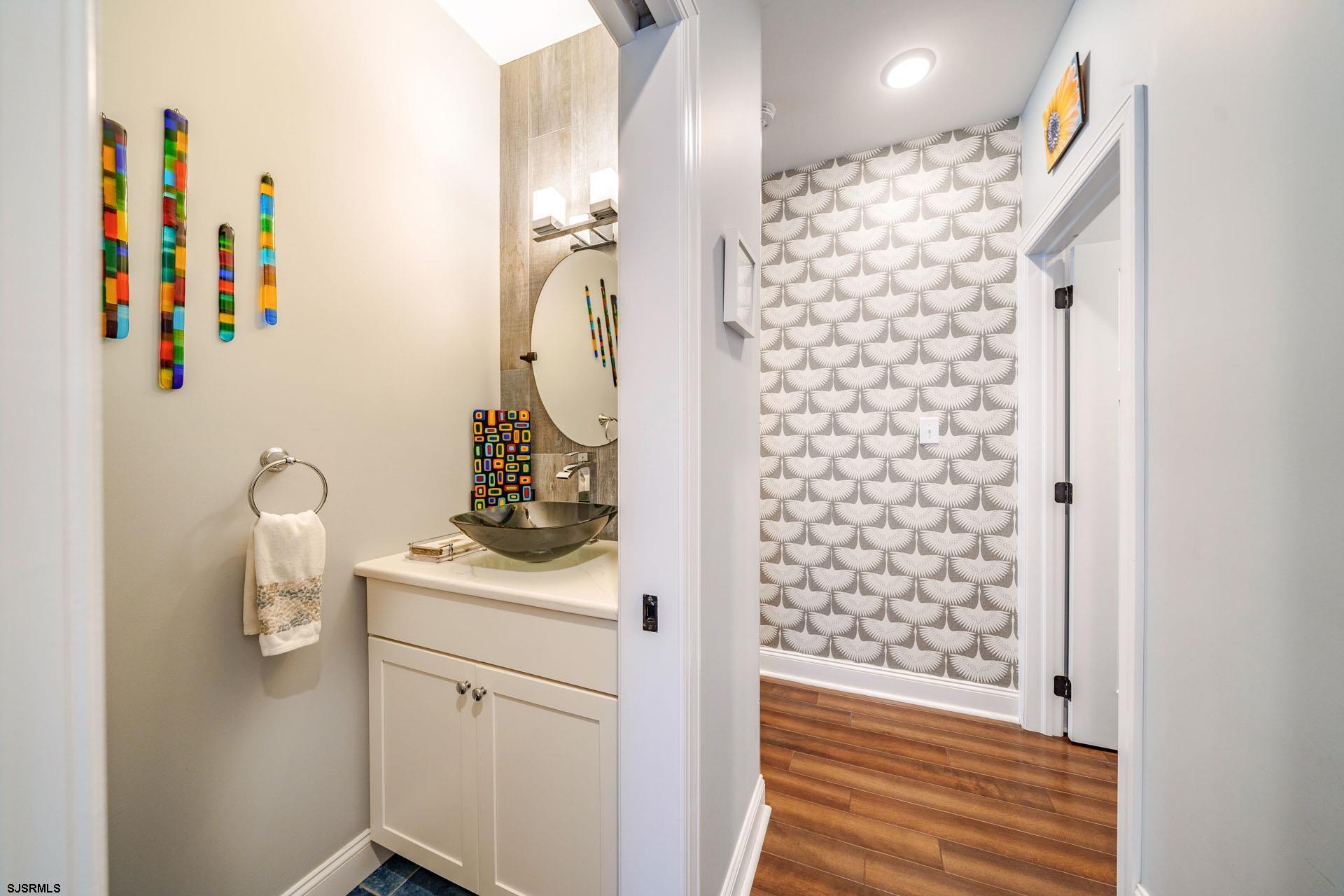 230 West Seaspray Road Ocean City, NJ 08226 - Photo 9 of 45 a bathroom with a sink toilet and shower