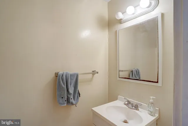 a bathroom with a sink and mirror