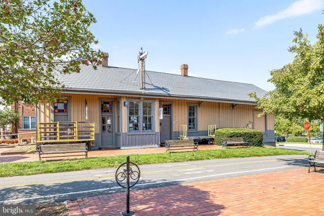 a city street lined with buildings and trees