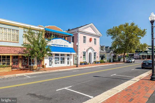 a view of a wooden deck and a yard