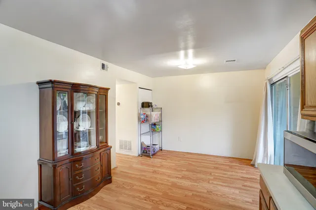 a view of a livingroom with wooden floor