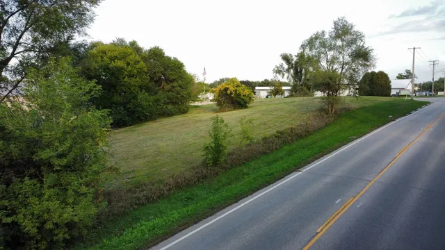 a view of a road with a yard