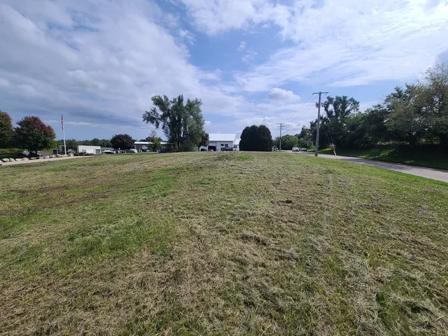 a view of a road with a building in the background