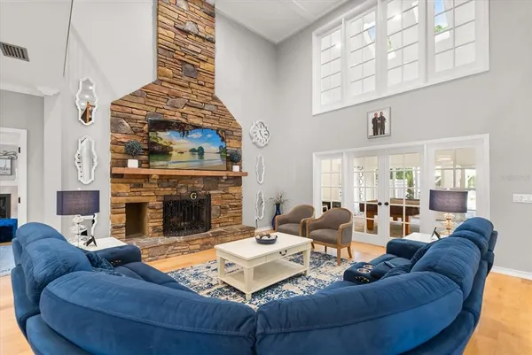 a kitchen with kitchen island a dining table and chairs