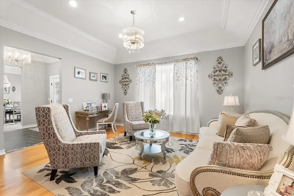 a living room with furniture kitchen view and a table
