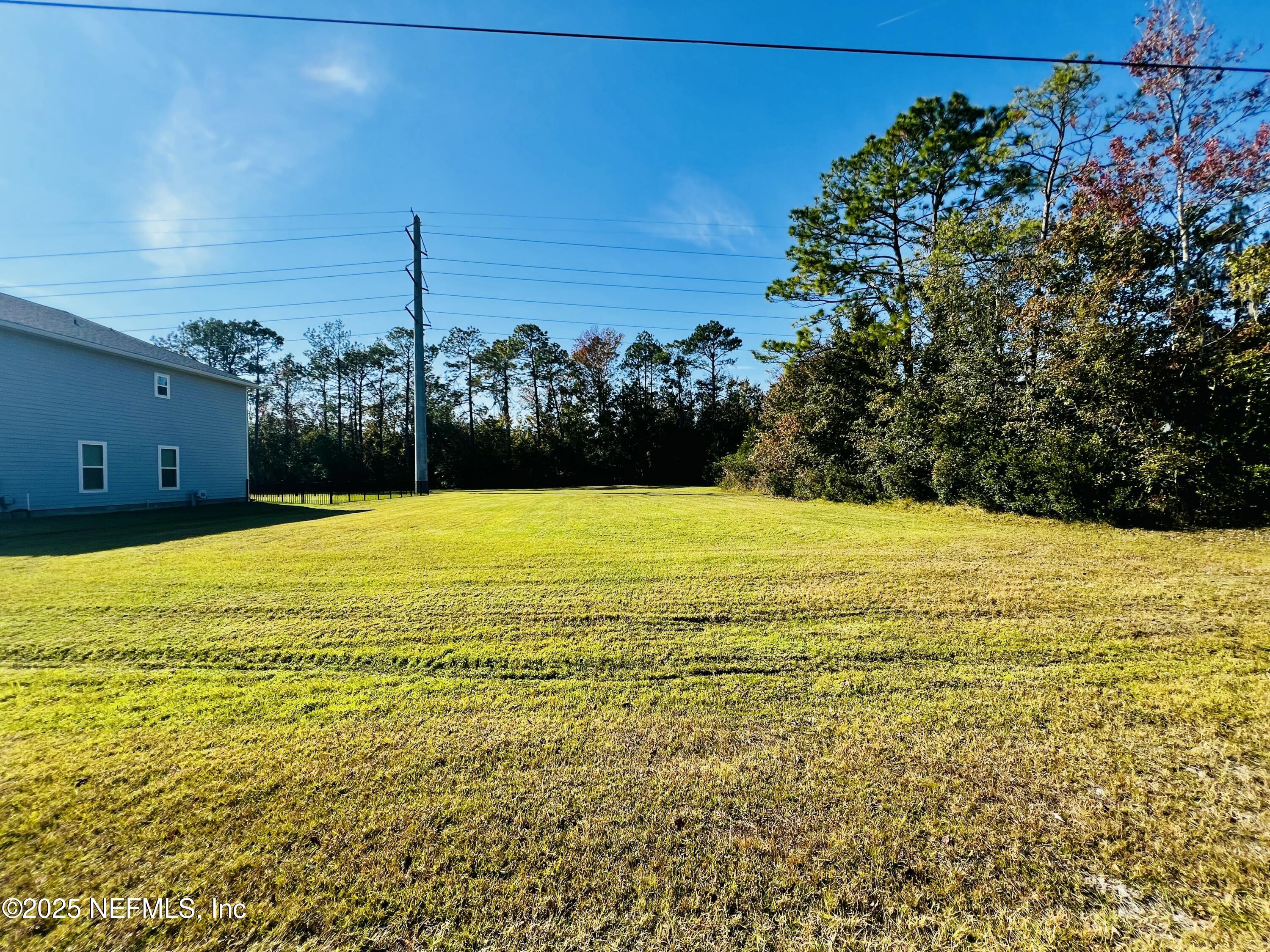 a view of an ocean and a yard
