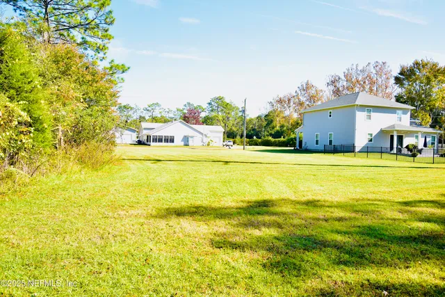 a view of a swimming pool and a yard