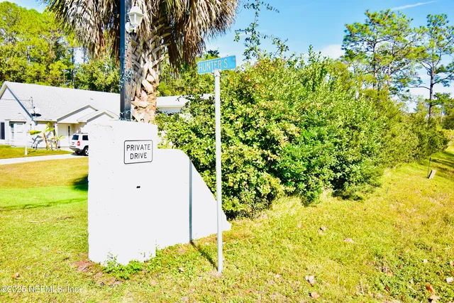 a view of a glass door with a bench