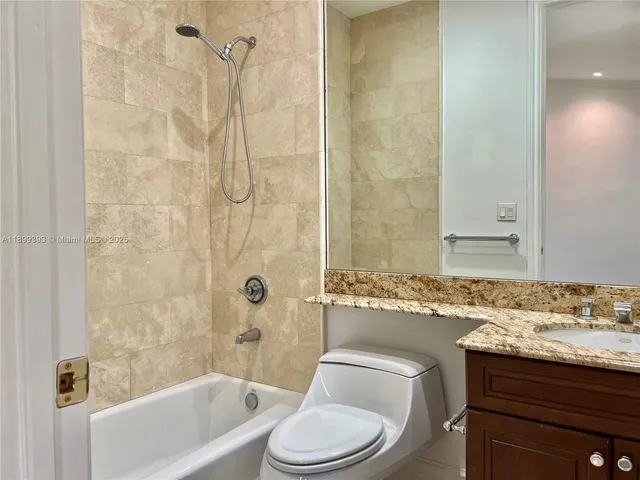 an empty room with a window and a ceiling fan