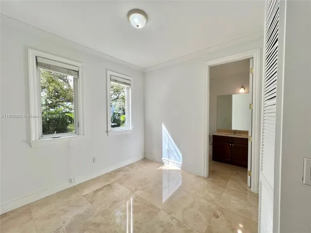 a bathroom with a granite countertop sink mirror and a bath tub