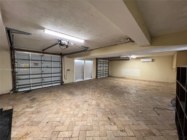 a backyard of a house with barbeque oven table and chairs