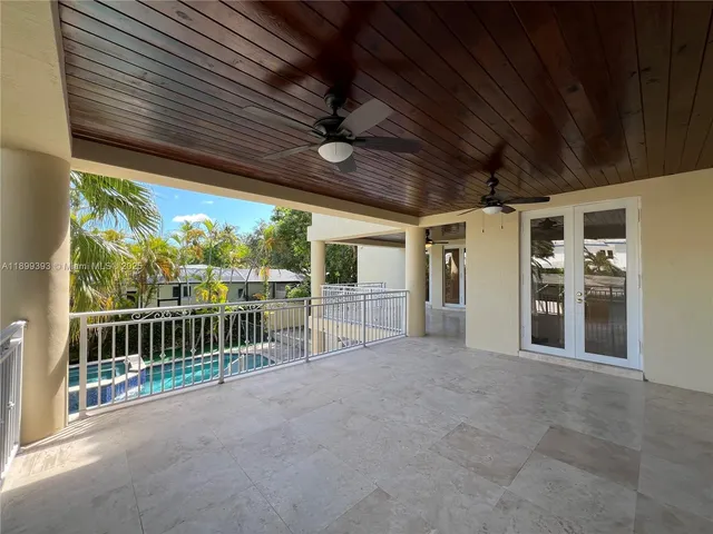 a view of a backyard with swimming pool