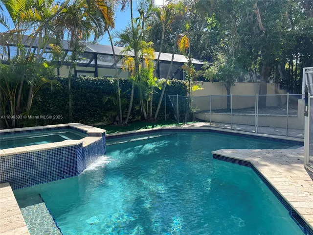 a view of empty room with a fireplace and wooden floor