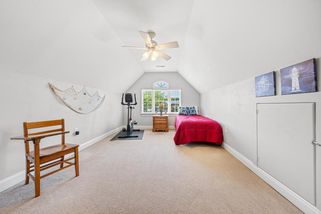 217 Maret Road Townville, SC 29689 - Photo 27 of 35 A versatile bonus room offers carpeted floors, an arched window, and a convenient ceiling fan.