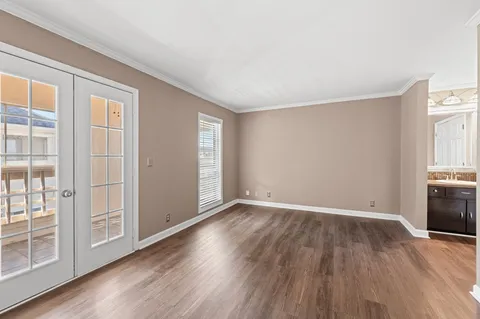 a bathroom with a tub shower and a sink