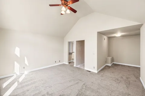 a bathroom with a granite countertop sink a mirror and shower