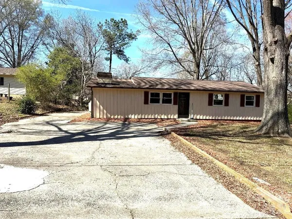 a view of a house with snow on the background