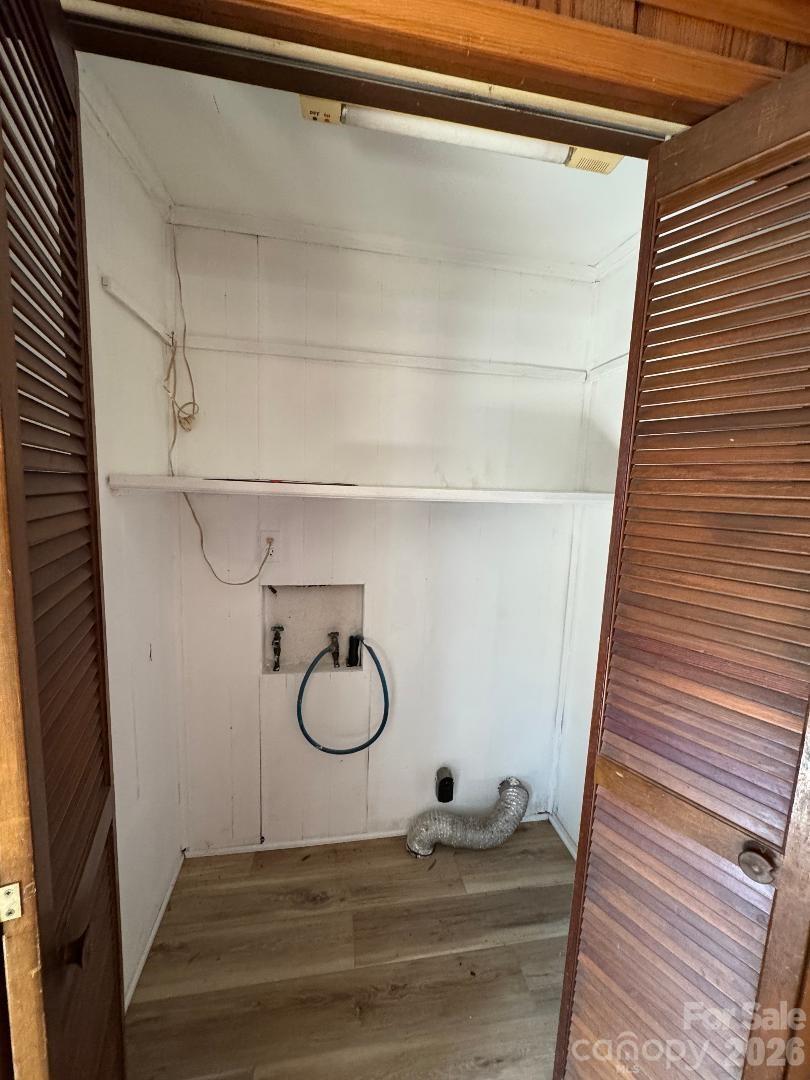 303 Green Street Biscoe, NC 27209 - Photo 13 of 15 a bathroom with a sink and a mirror