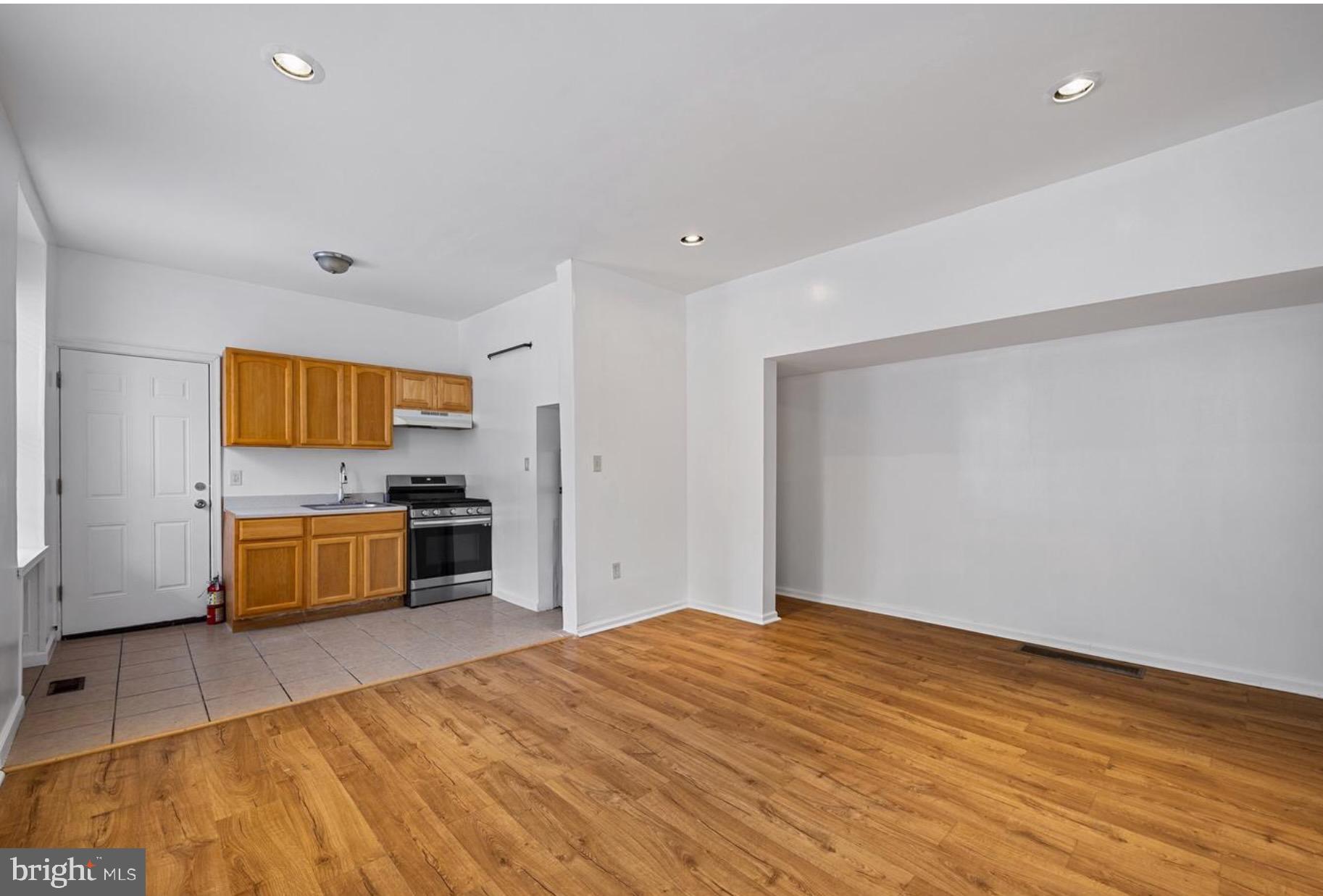 3800 Spring Garden Street, Unit 1 Philadelphia, PA 19104 - Photo 3 of 10 a bedroom with a bed and a flat screen tv