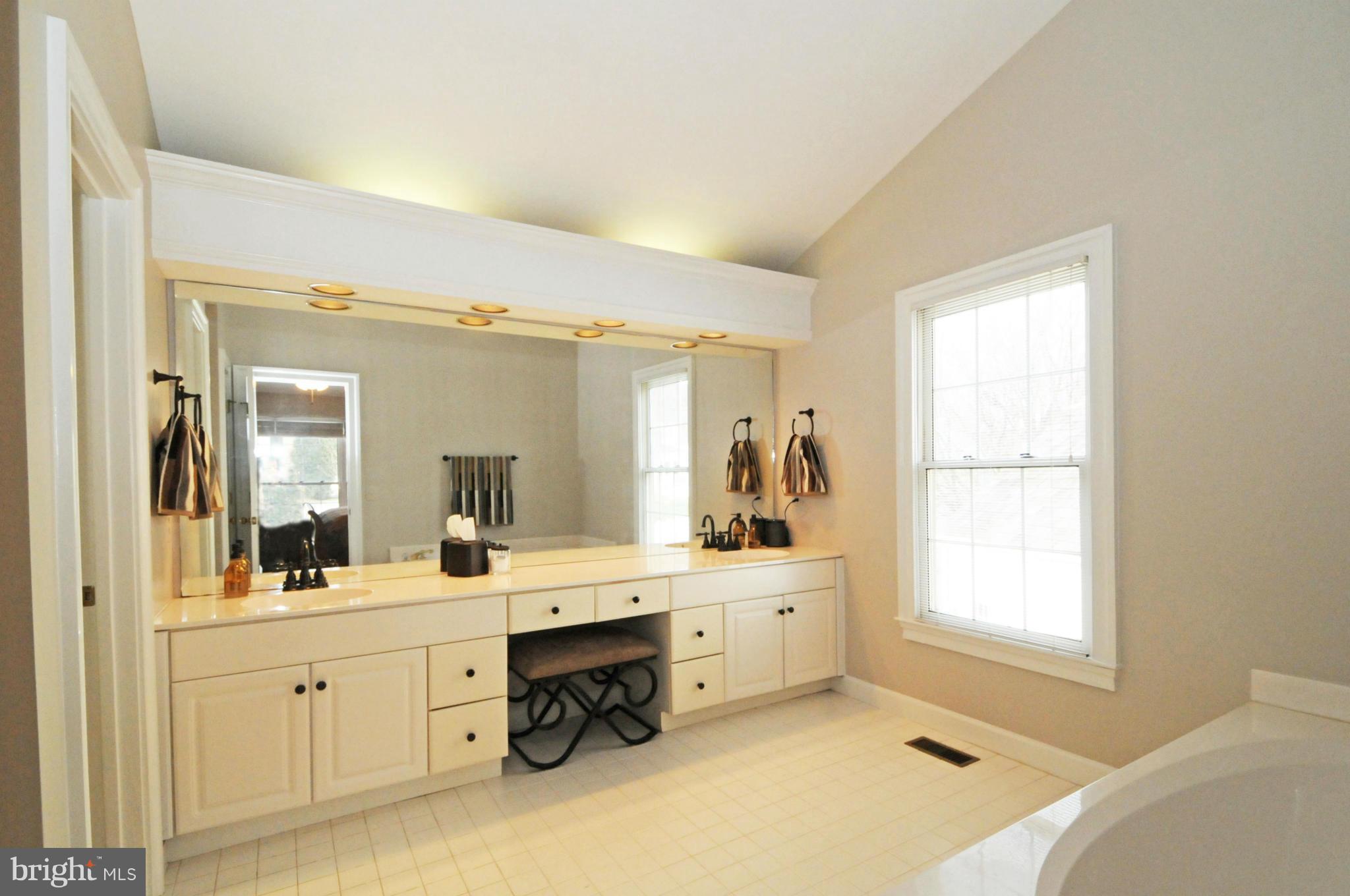 9731 Hidden Valley Road Vienna, VA 22181 - Photo 18 of 30 DOUBLE VANITIES AND A VAULTED CEILING