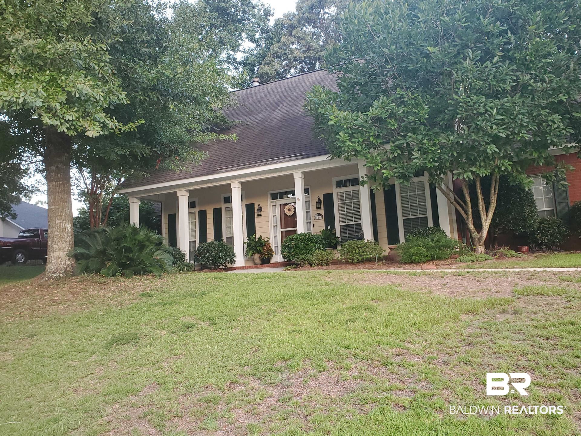 31163 Woodland Way Daphne, AL 36527 - Photo 4 of 44 View of front of property with a front lawn