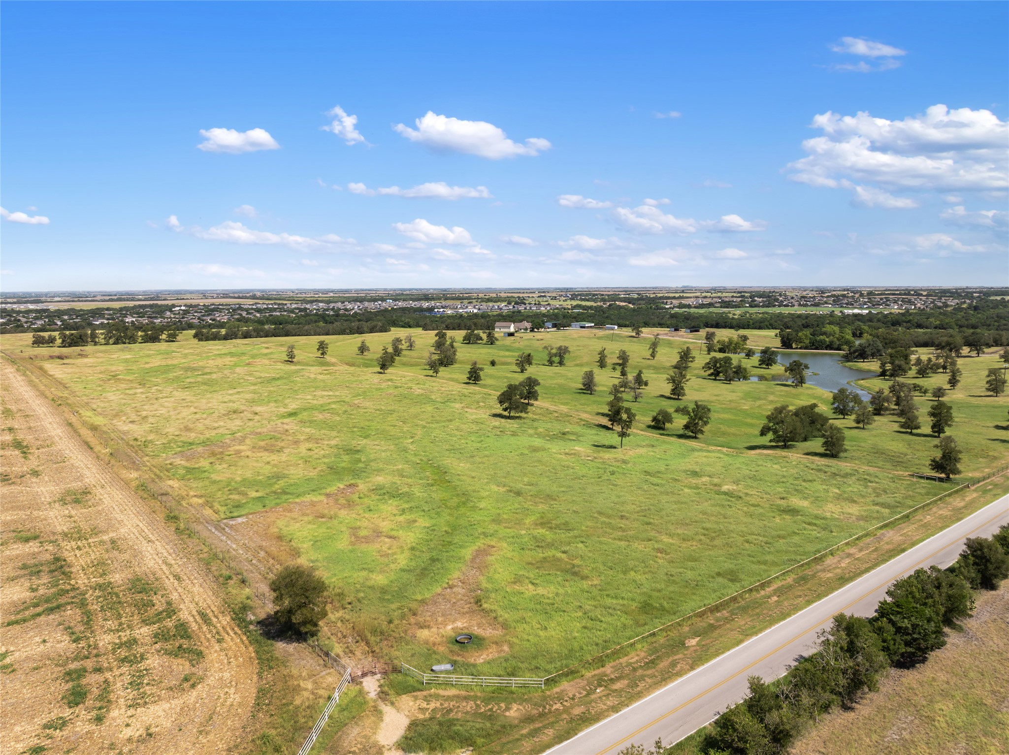 12500 County Line Road Elgin, TX 78621 - Photo 4 of 9 Overview of rural landscape featuring a large body of water