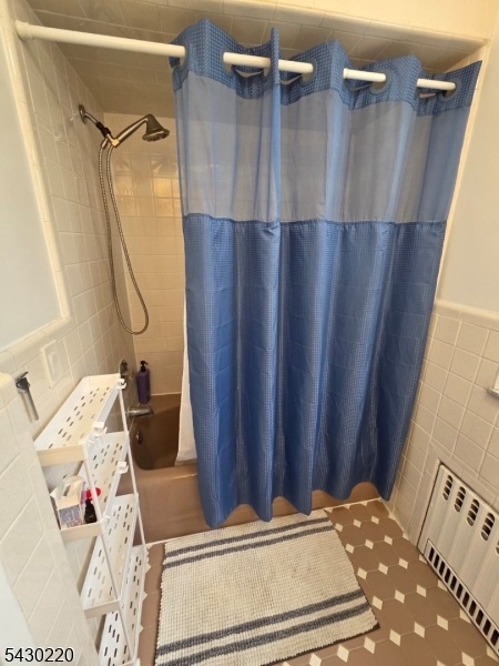 166 Carmita Avenue Rutherford, NJ 07070 - Photo 17 of 27 a view of walk in closet with clothes and shoes
