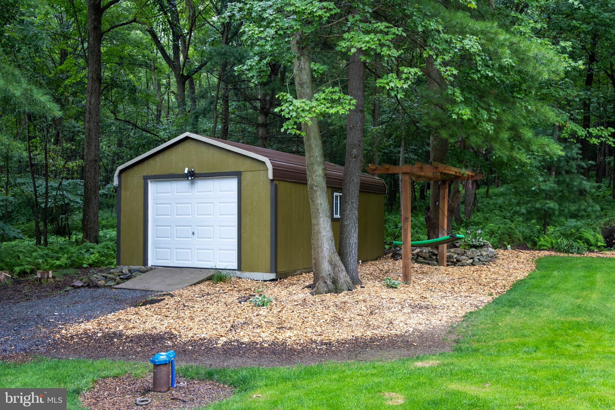 348 Decker Valley Road Spring Mills, PA 16875 - Photo 27 of 28 Charming shed nestled in lush greenery.