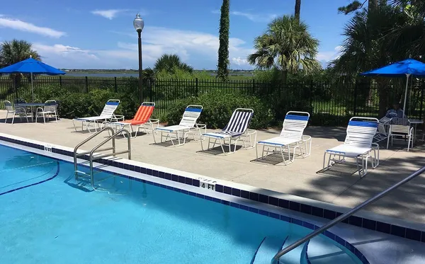 a view of an outdoor sitting area with furniture and umbrella