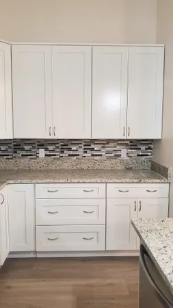 a view of cabinets with granite countertop cabinets