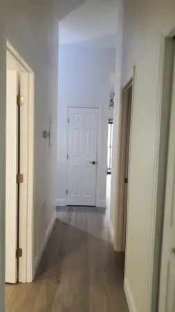 an empty room with closet and a bathroom