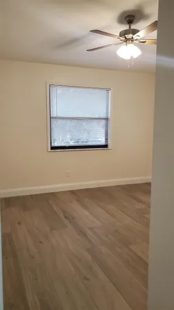 a view of a ceiling fan with a window