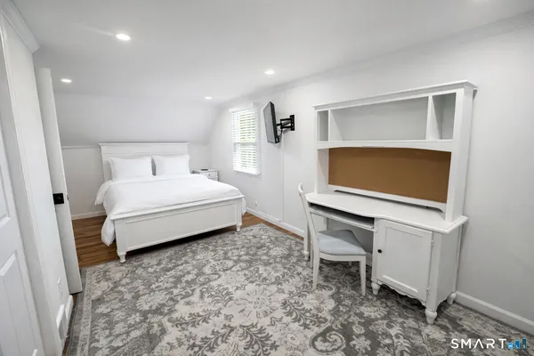 a living room with a couch and a dresser