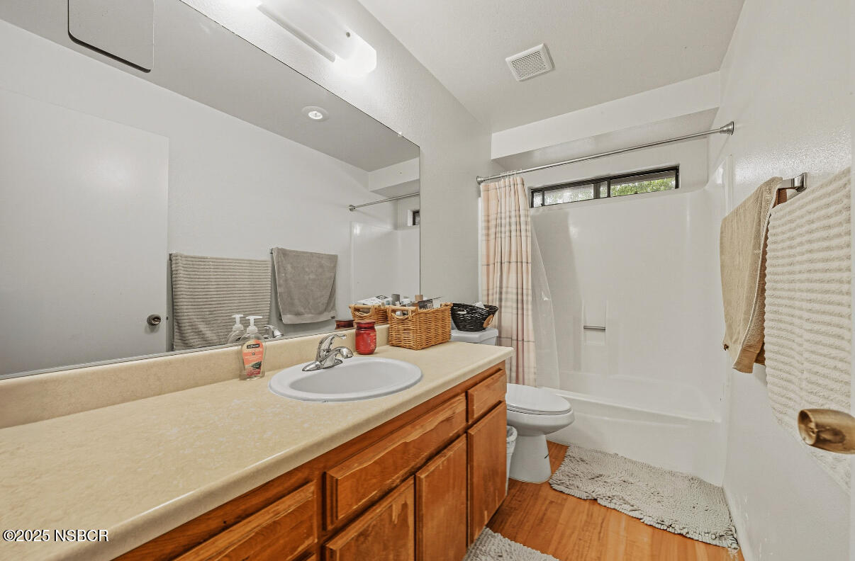 1210 East Walnut Avenue, Unit D Lompoc, CA 93436 - Photo 13 of 15 a bathroom with a sink a toilet and shower