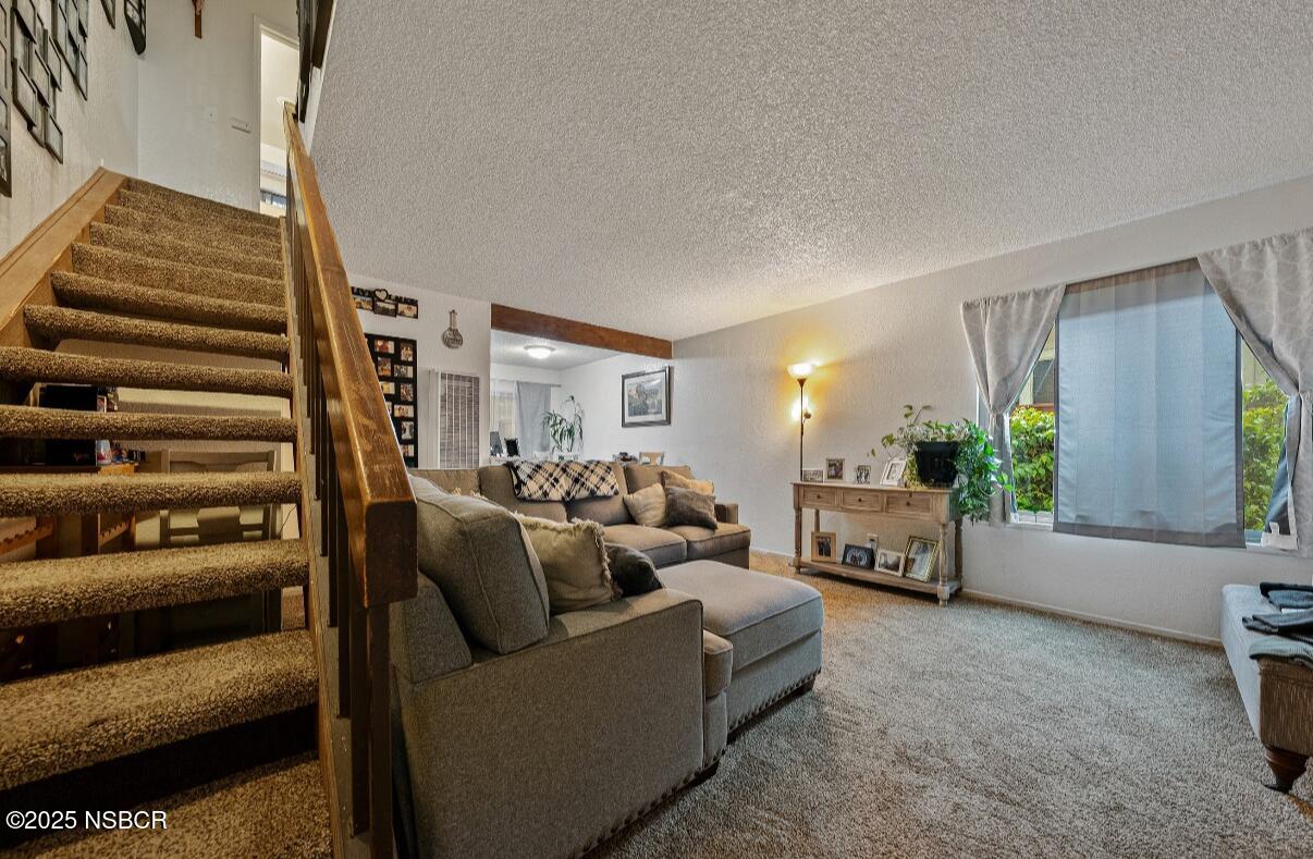 1210 East Walnut Avenue, Unit D Lompoc, CA 93436 - Photo 4 of 15 a living room with furniture and a fireplace