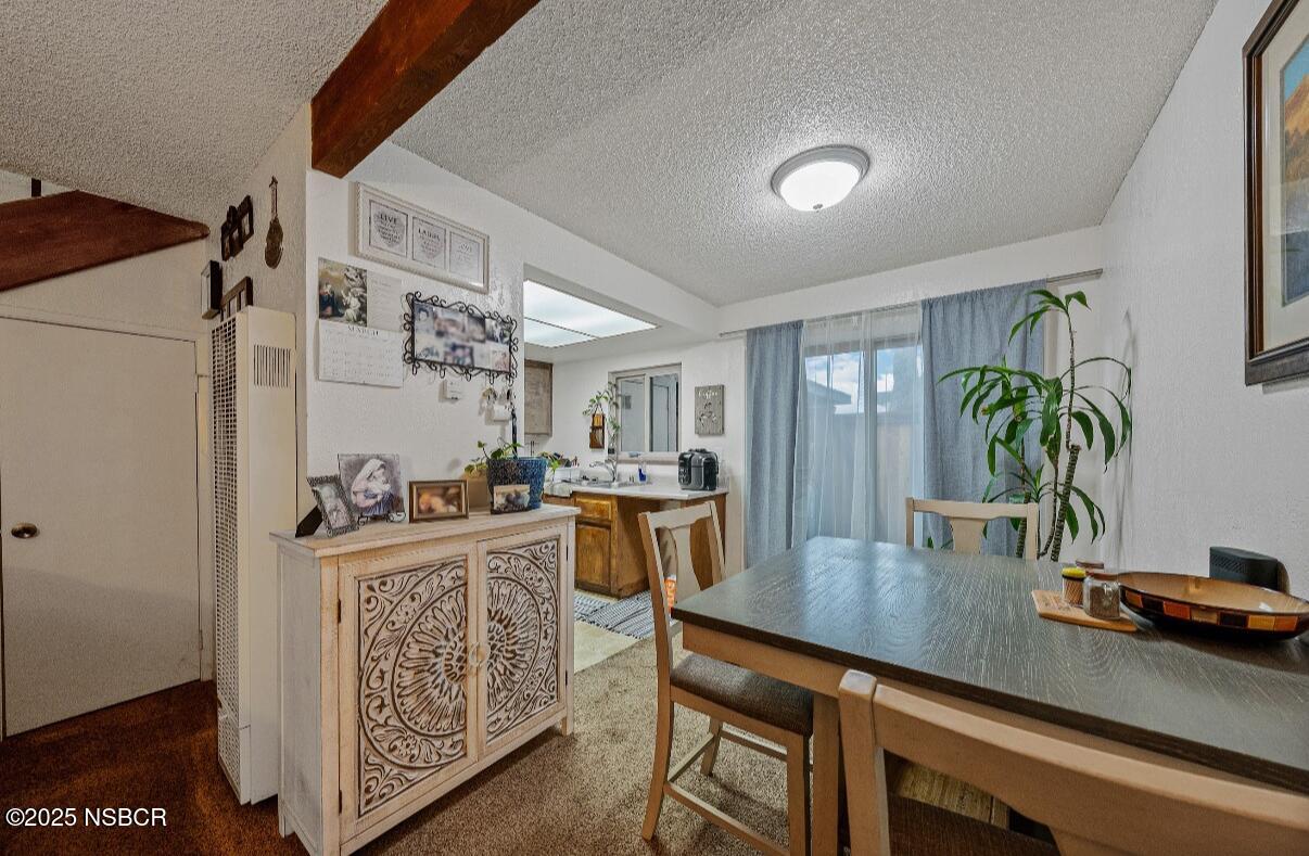 1210 East Walnut Avenue, Unit D Lompoc, CA 93436 - Photo 6 of 15 a kitchen with a table and chairs