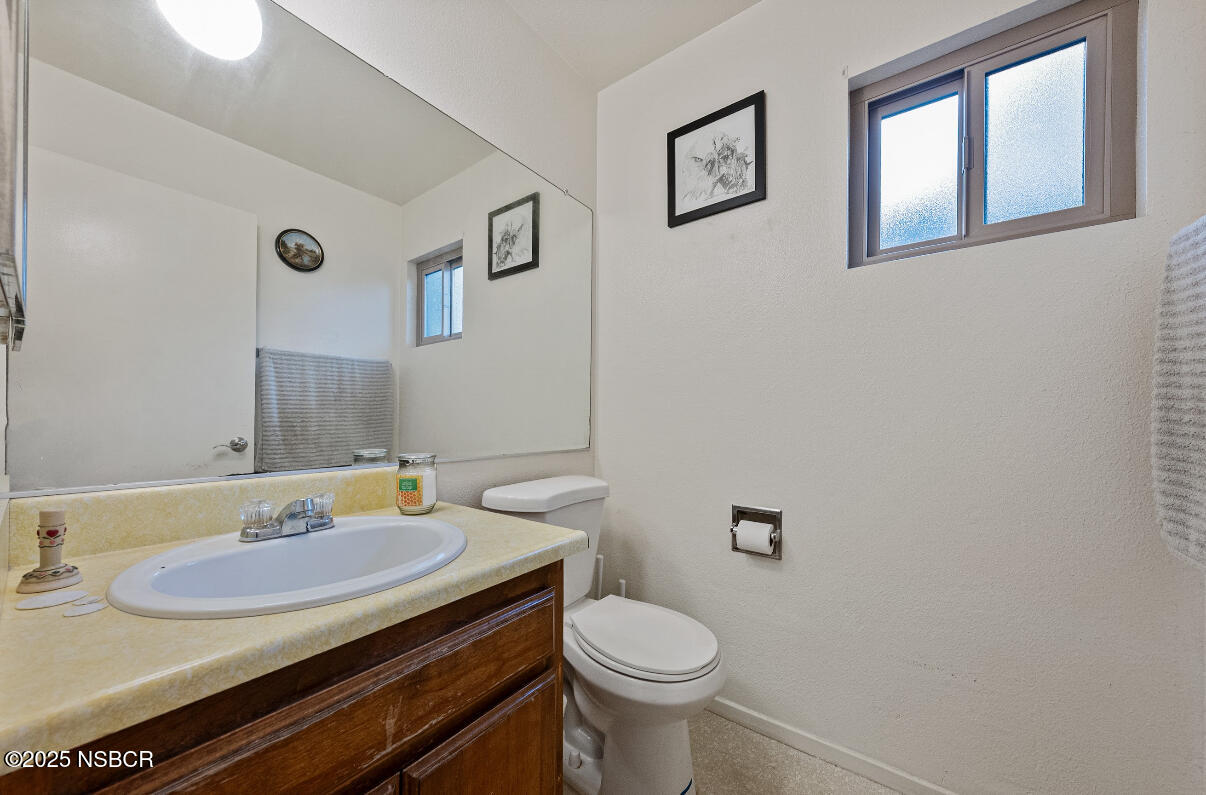 1210 East Walnut Avenue, Unit D Lompoc, CA 93436 - Photo 9 of 15 a bathroom with a sink and a mirror