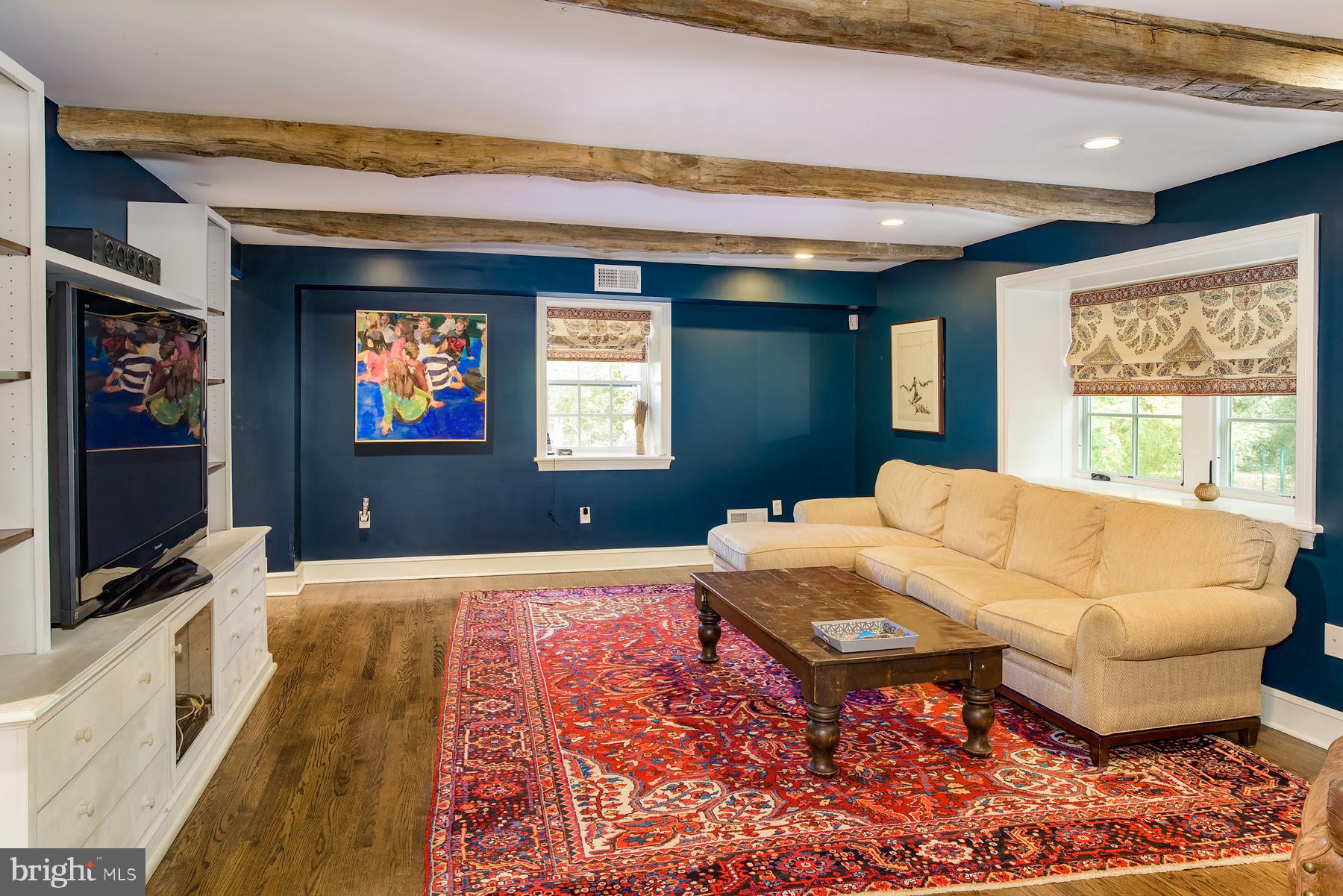 412 Righters Mill Road Narberth, PA 19072 - Photo 11 of 53 a living room with a bed furniture and a flat screen tv