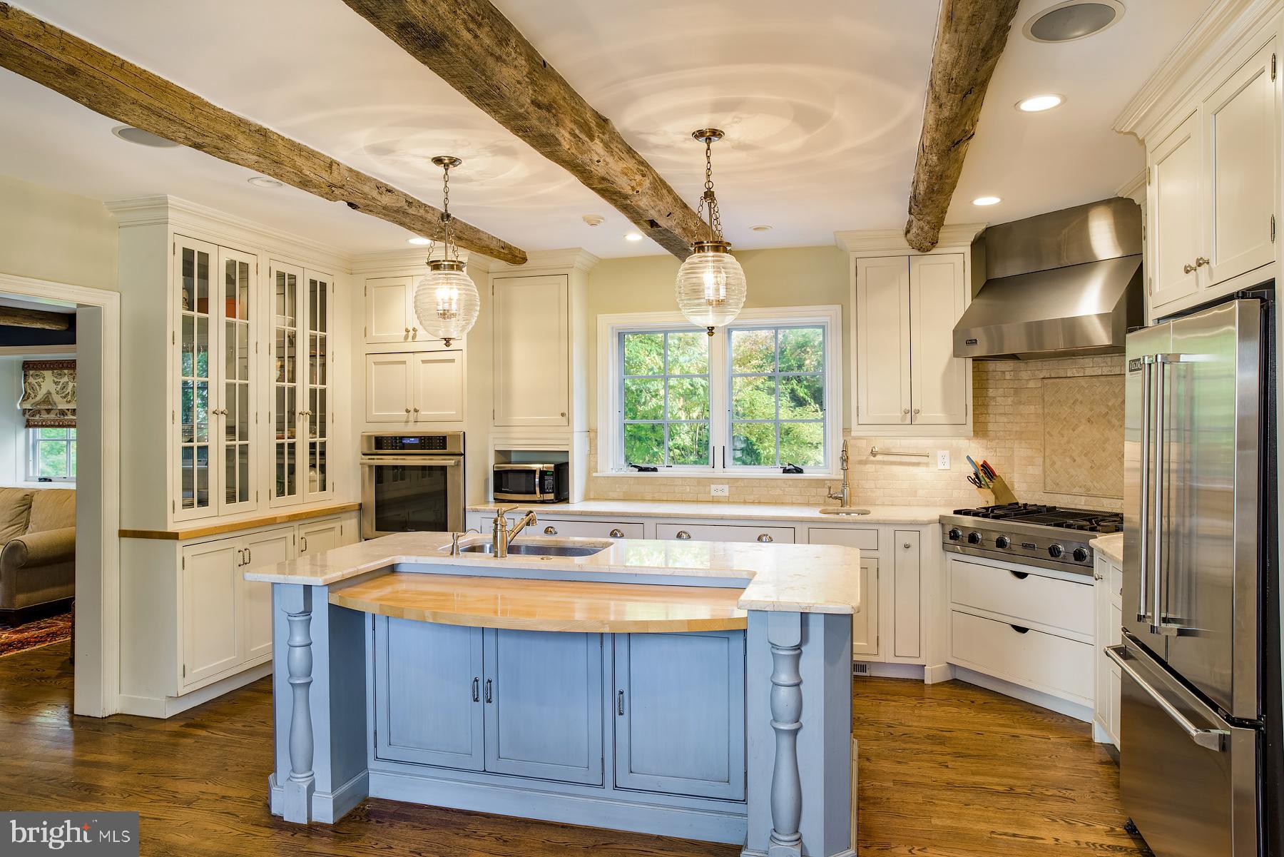 412 Righters Mill Road Narberth, PA 19072 - Photo 17 of 53 a kitchen with wooden floors and white appliances