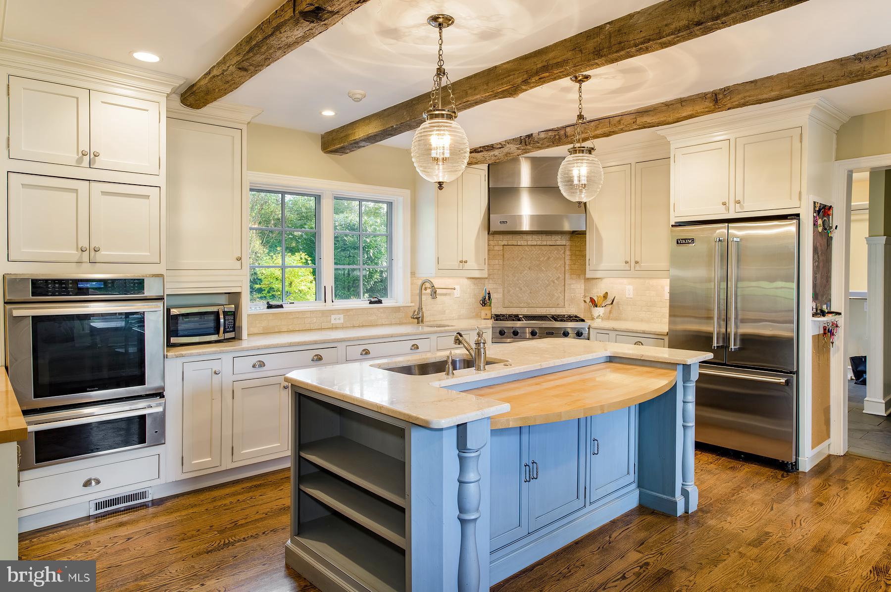 412 Righters Mill Road Narberth, PA 19072 - Photo 19 of 53 a kitchen with a stove a sink and a refrigerator