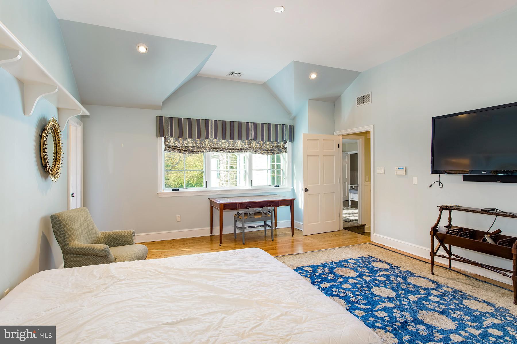 412 Righters Mill Road Narberth, PA 19072 - Photo 22 of 53 a bedroom with a bed and a flat screen tv
