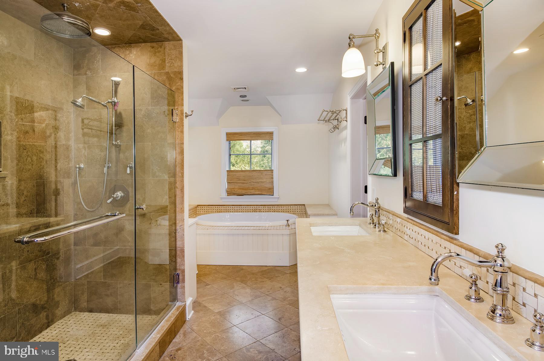 412 Righters Mill Road Narberth, PA 19072 - Photo 25 of 53 a bathroom with a tub sink and mirror