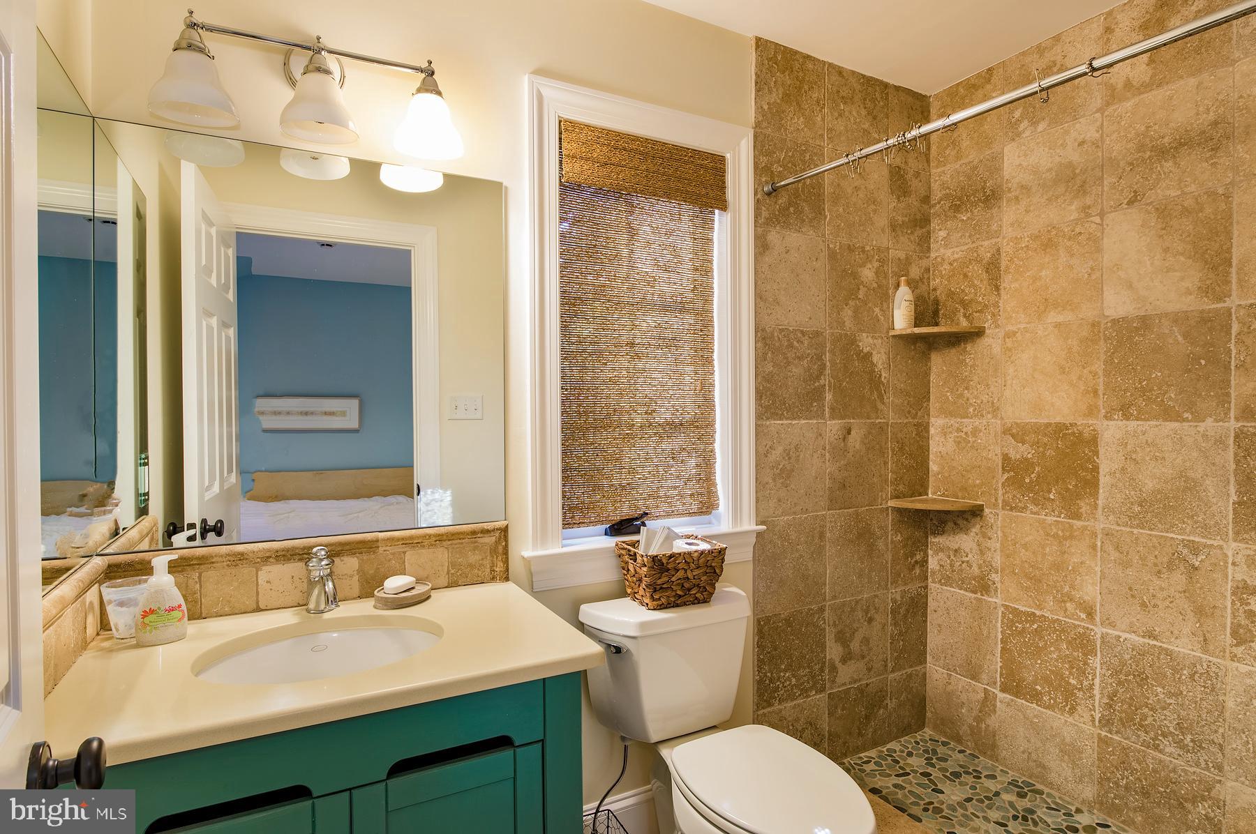 412 Righters Mill Road Narberth, PA 19072 - Photo 30 of 53 a bathroom with a sink toilet a mirror and shower