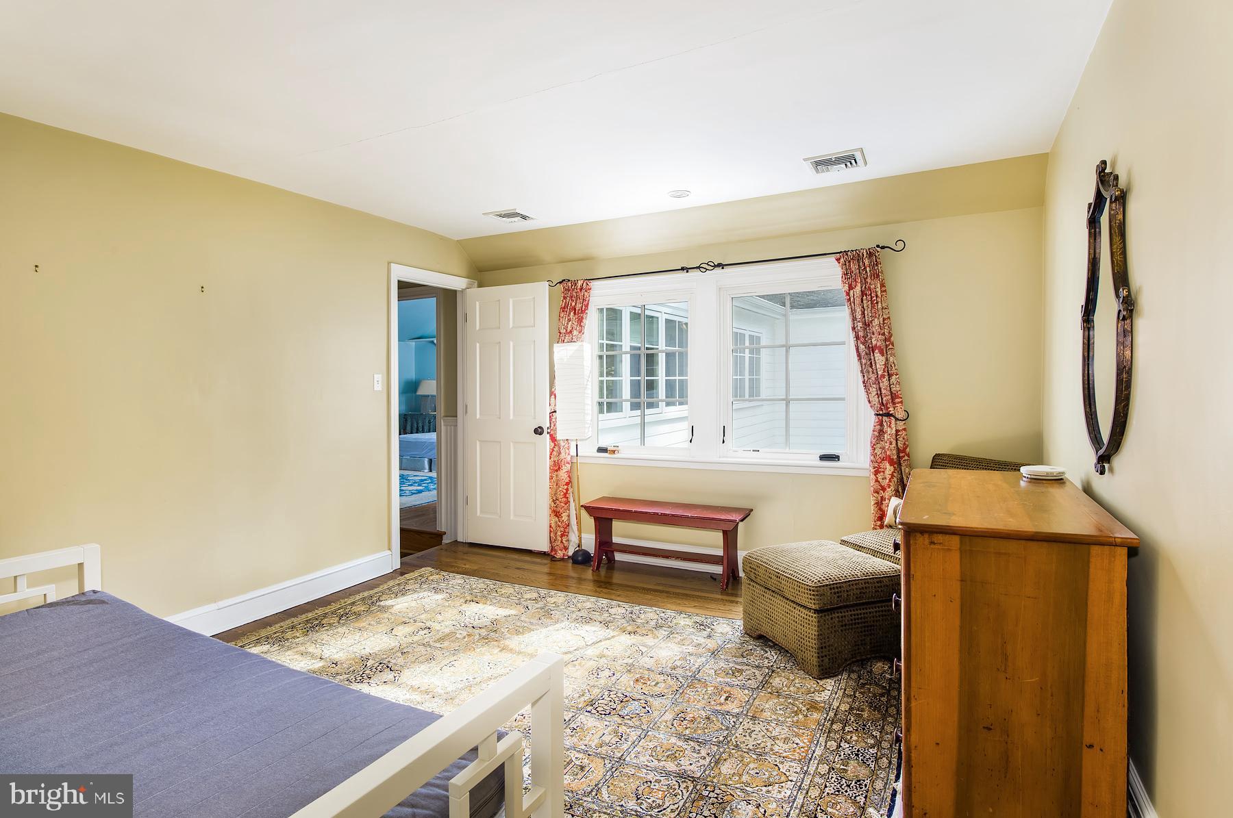 412 Righters Mill Road Narberth, PA 19072 - Photo 31 of 53 a spacious bedroom with a bed and wooden floor