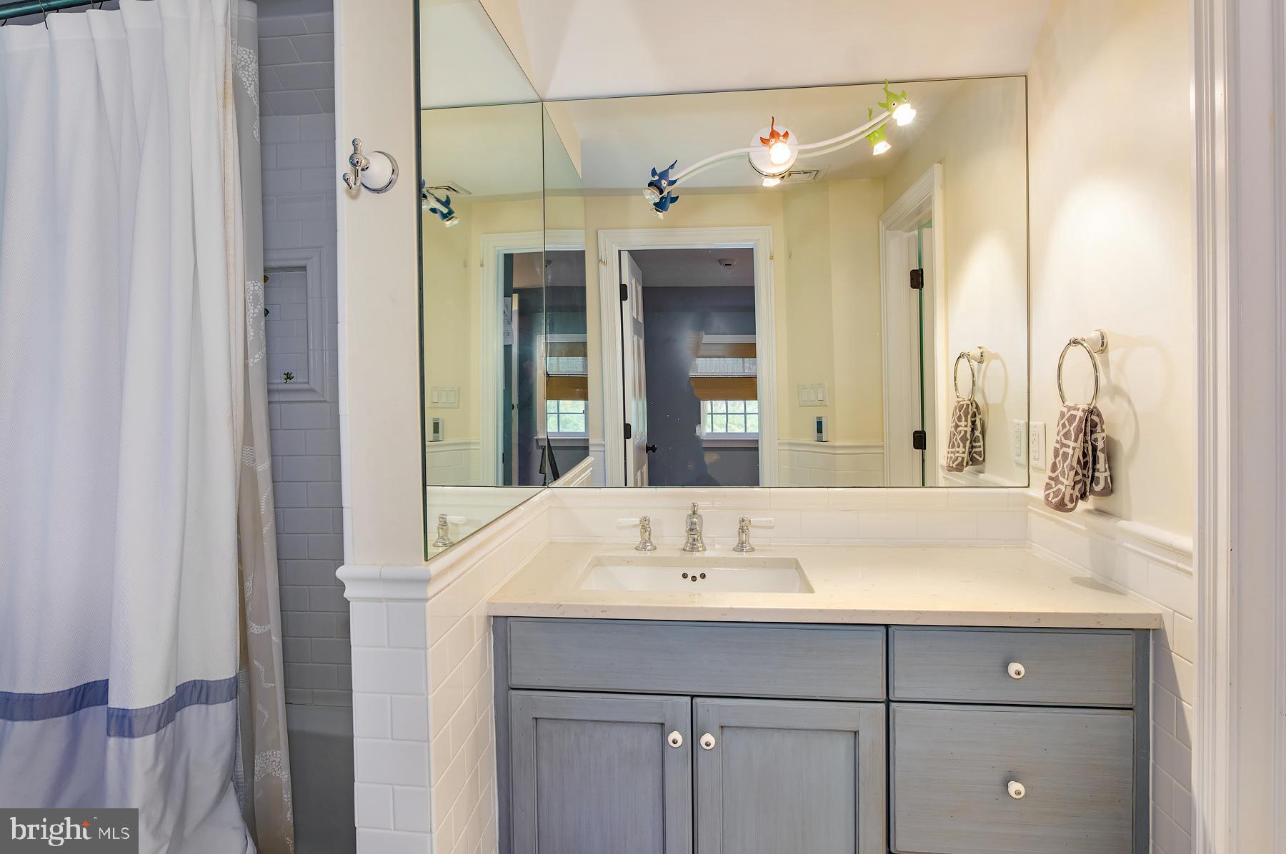 412 Righters Mill Road Narberth, PA 19072 - Photo 33 of 53 a bathroom with a sink and a mirror