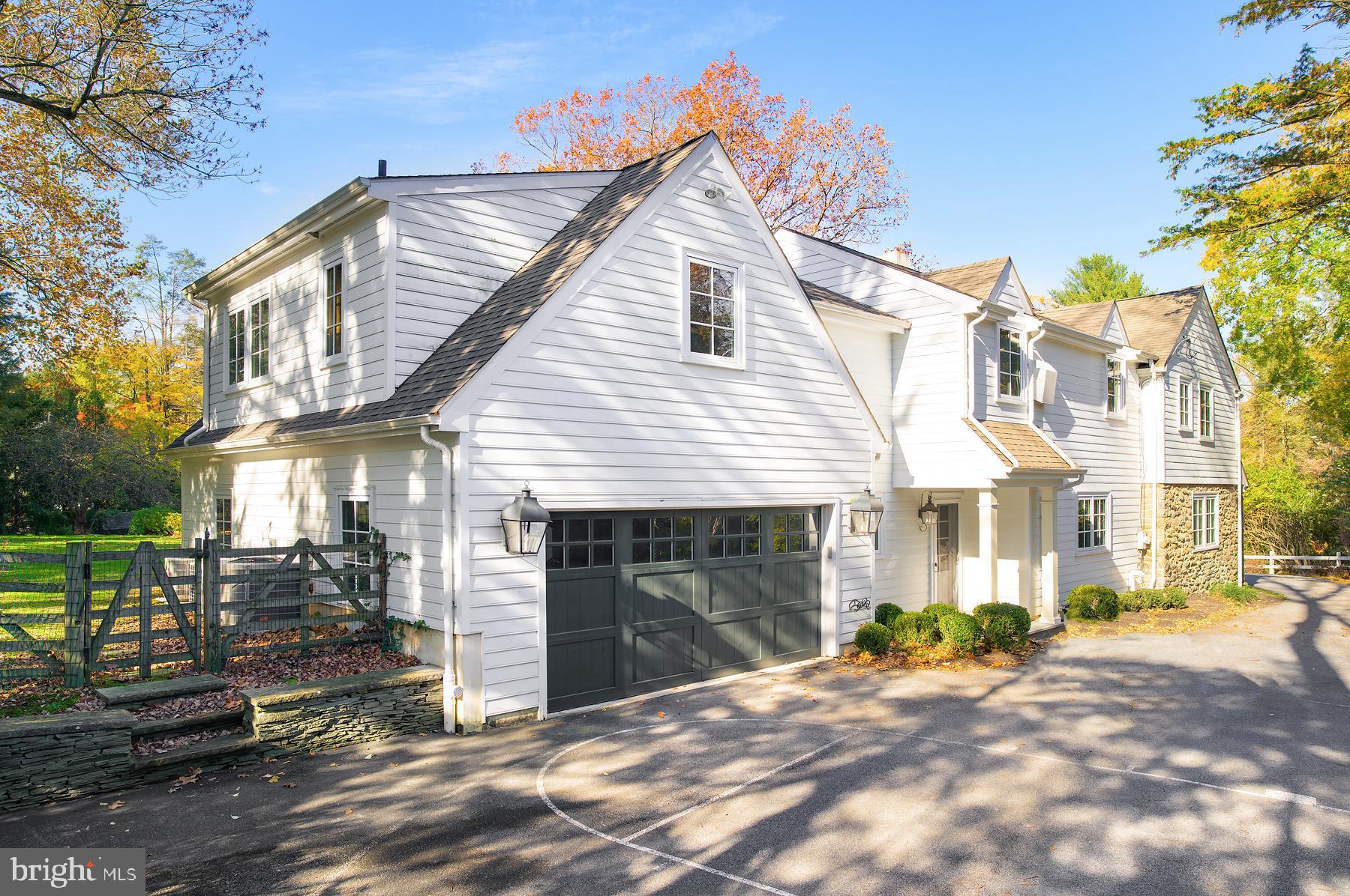 412 Righters Mill Road Narberth, PA 19072 - Photo 37 of 53 a front view of a house with a yard