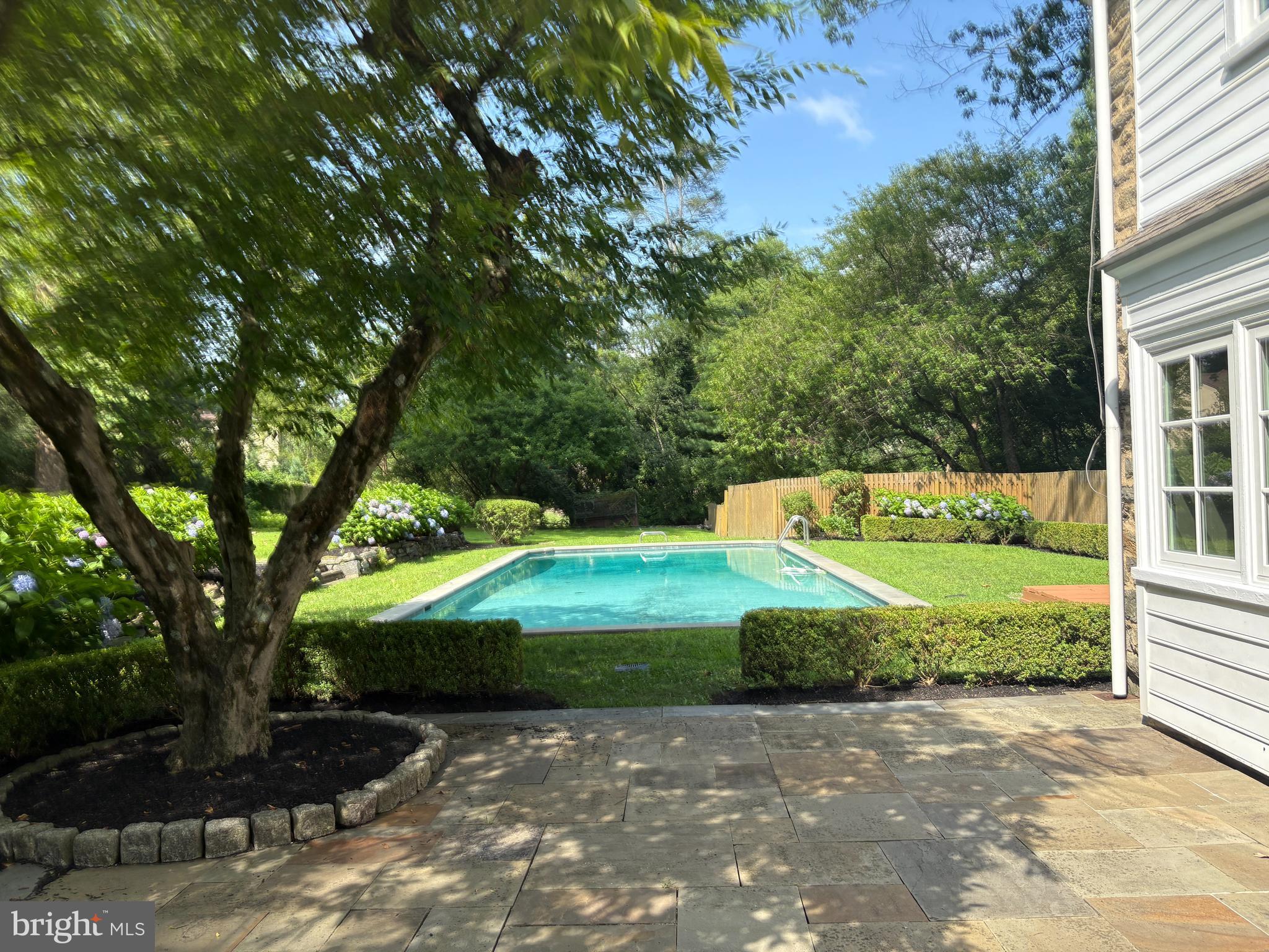 412 Righters Mill Road Narberth, PA 19072 - Photo 40 of 53 a view of a garden with plants and large trees