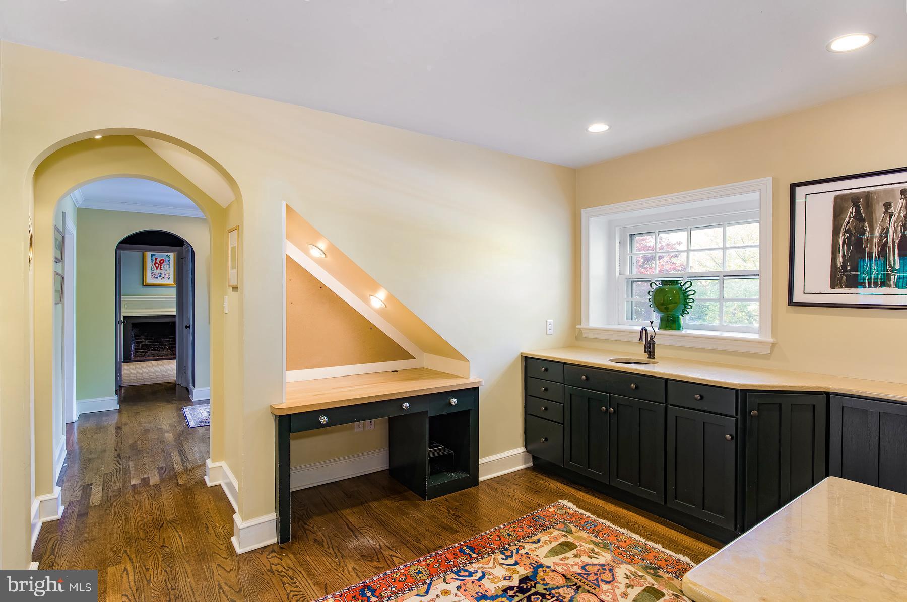 412 Righters Mill Road Narberth, PA 19072 - Photo 10 of 53 a hallway with sink and mirror